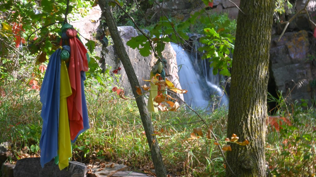Prayer cloths tied to trees flutter in the breeze, carrying prayers much like the smoke of the ceremonial pipe.