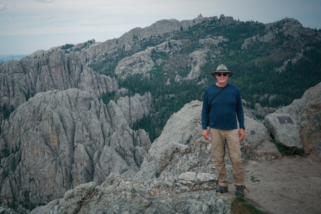 A rare photo of myself on this site. I'm standing on the summit of Little Devils Tower (6,959ft). Behind me is the highest point east of the Rocky Mountains. At 7,244ft, Black Elk Peak is literally the crown of the granite batholith—the solidified magma body that forms the core of the Black Hills uplift.