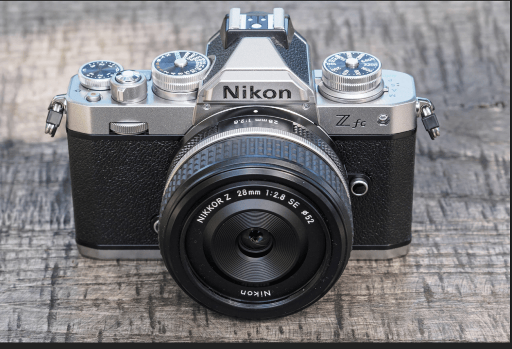 Nikon Zfc camera in black and silver with a Nikoor Z 28mm/1.28 lens